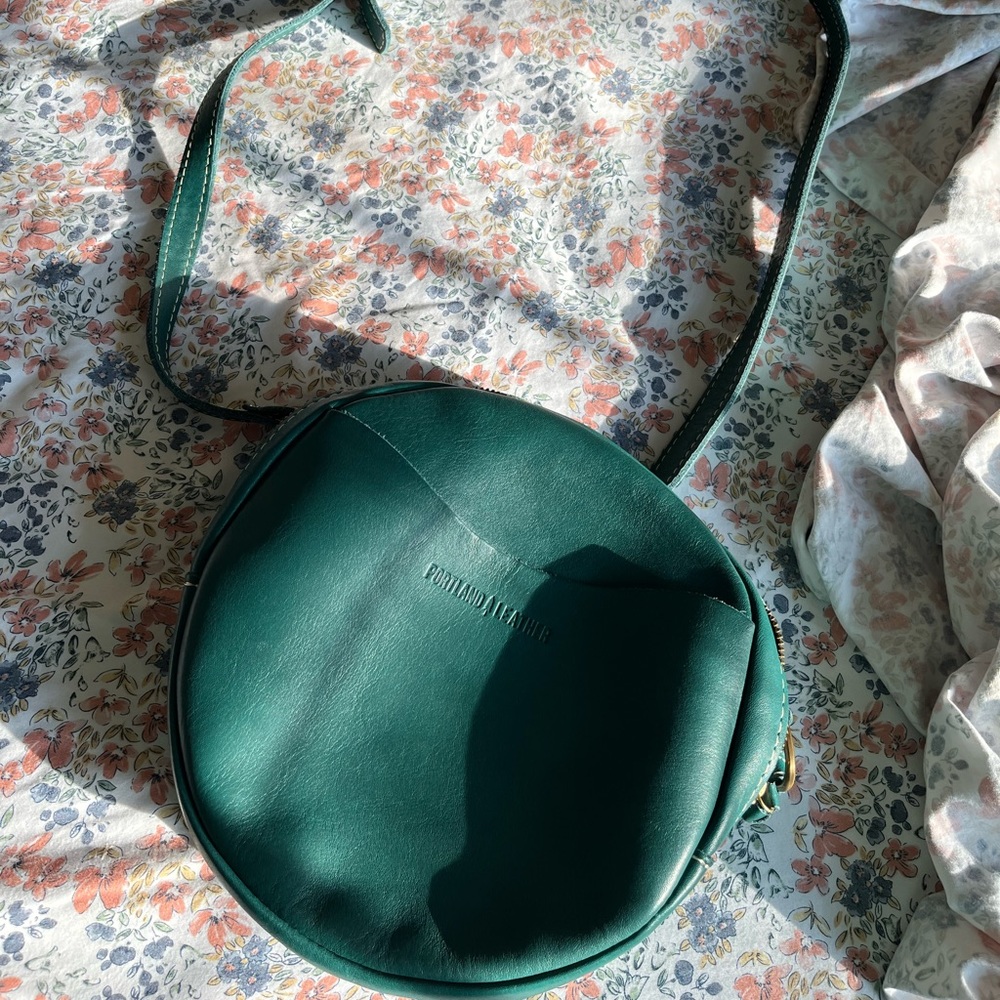 Portland leather large circle crossbody in peacock. Leather
